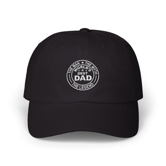 Man wearing a black hat with circular white embroidery reading “World’s Best Dad – The Man The Myth The Legend” in a bold badge style