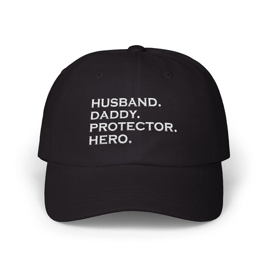 cap with bold white embroidered text: "Husband. Daddy. Protector. Hero." – ideal gift for fathers and husbands.