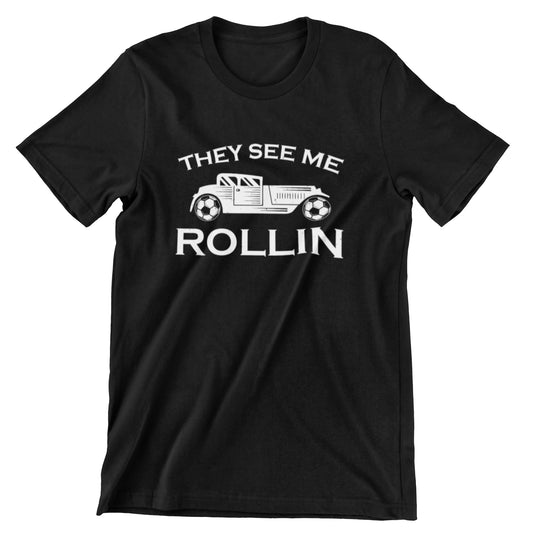 vintage car T-shirt with "They See Me Rollin" design and soccer ball wheels