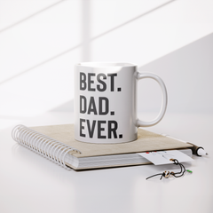 Best_Dad_Ever_Mug__11oz_White_Ceramic_Lifestyle_Notebook_Mockup.png