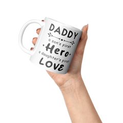 Daddy_Mug_-_A_Sons_First_Hero_A_Daug_Lifestyle_Raised_Hand_LH_Mockup.png