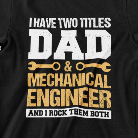 I Have Two Titles Dad & Mechanical Engineer T-shirt featuring a bold design with wrench and gear icons. Text: 'I Have Two Titles Dad & Mechanical Engineer And I Rock Them Both