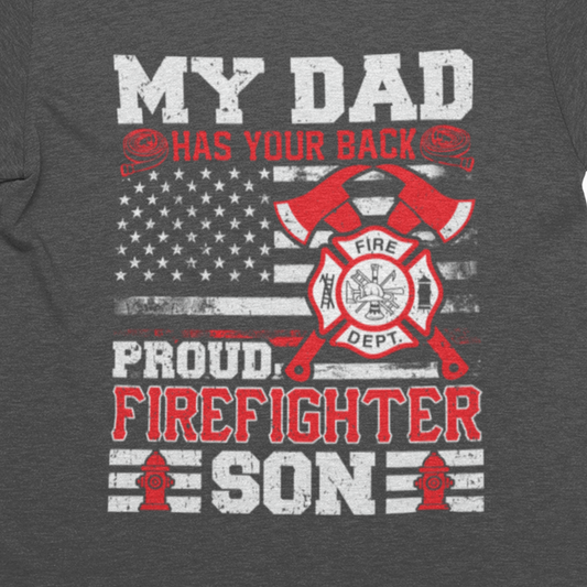 T-shirt design with American flag, axes, and text "My Dad Has Your Back – Proud Firefighter Son
