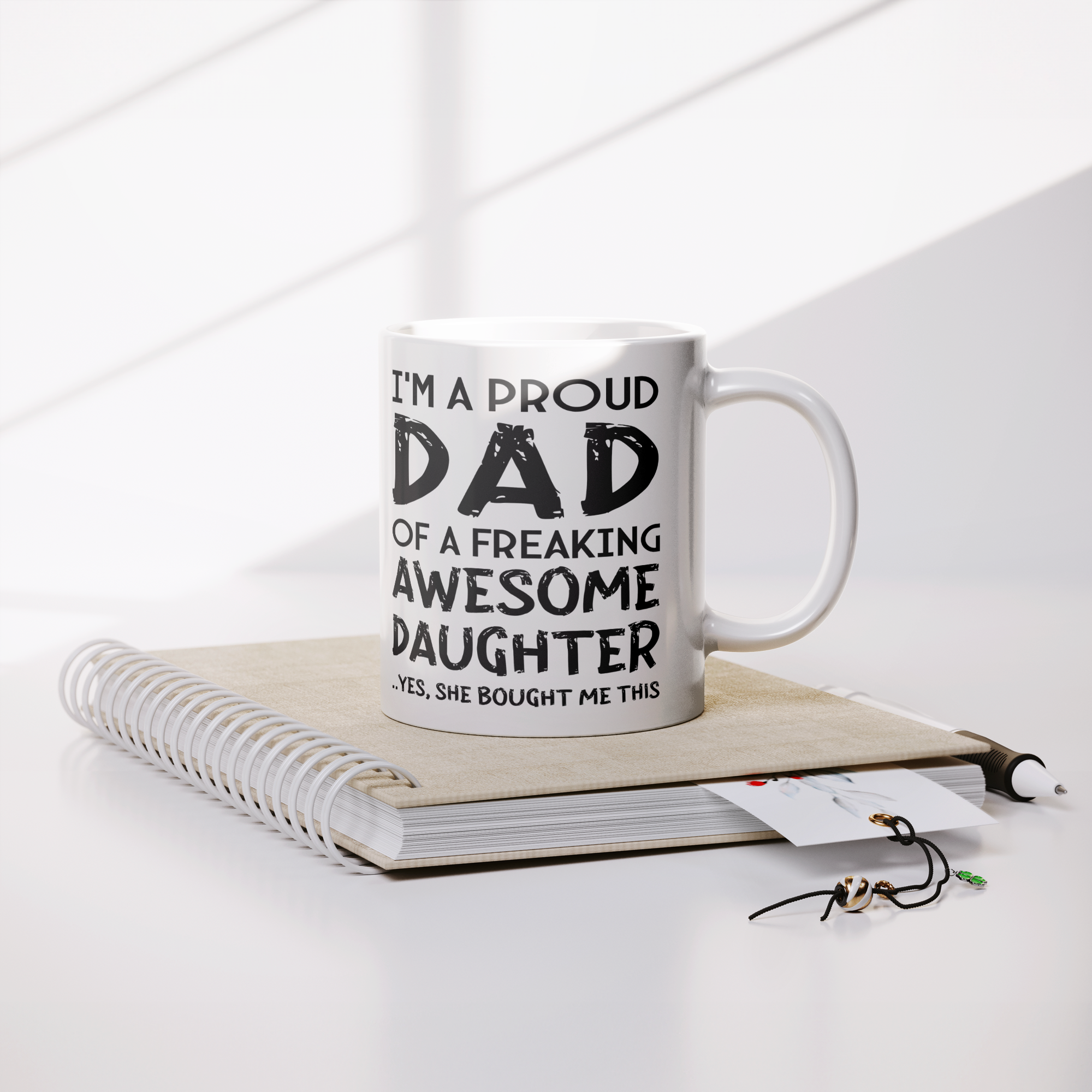 Proud_Dad_Mug_-_Freaking_Awesome_Daughte_Lifestyle_Notebook_Mockup.png
