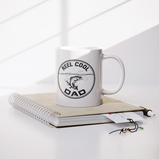 11oz Ceramic Mug with “Reel Cool Dad” Fishing Design and Jumping Fish Illustration