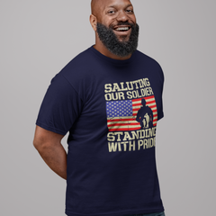 ‘Saluting Our Soldier Standing With Pride’ text, American flag background, and soldier silhouette with saluting family