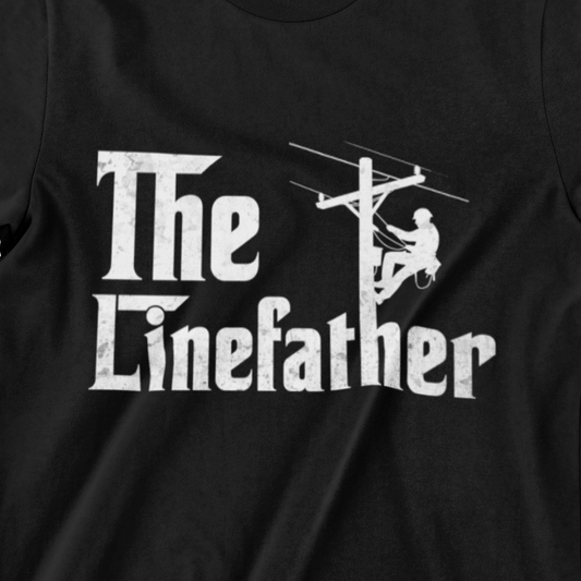 The Linefather T-shirt – White Text with Lineman Climbing Utility Pole on Black Shir