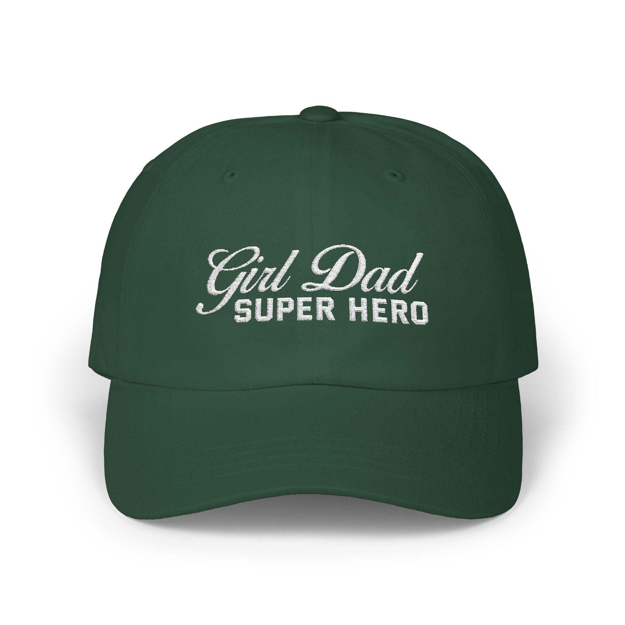 Woman wearing a black hat with mixed-script embroidered text reading “Girl Dad Super Hero” standing against a chain-link fence