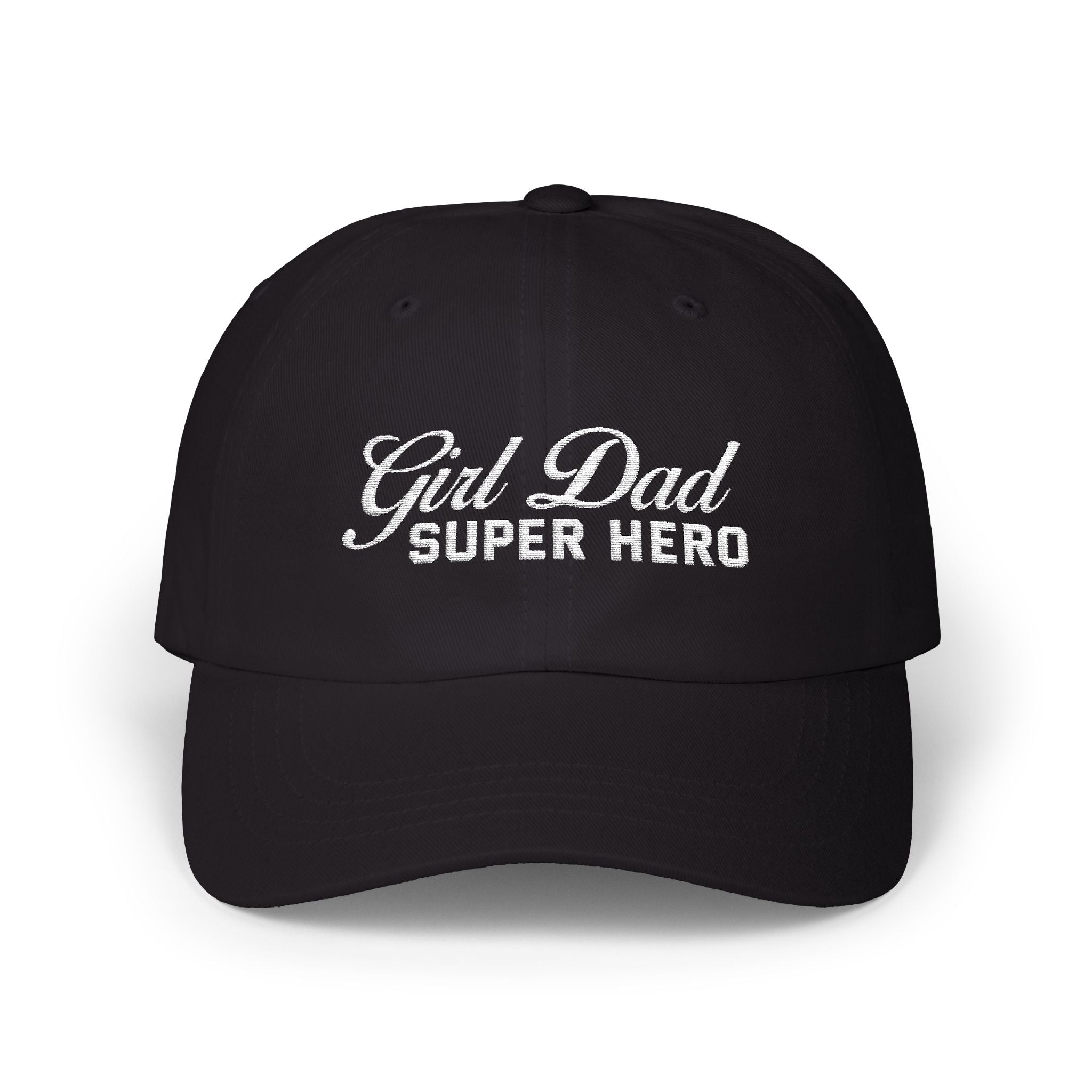 Woman wearing a black hat with mixed-script embroidered text reading “Girl Dad Super Hero” standing against a chain-link fence