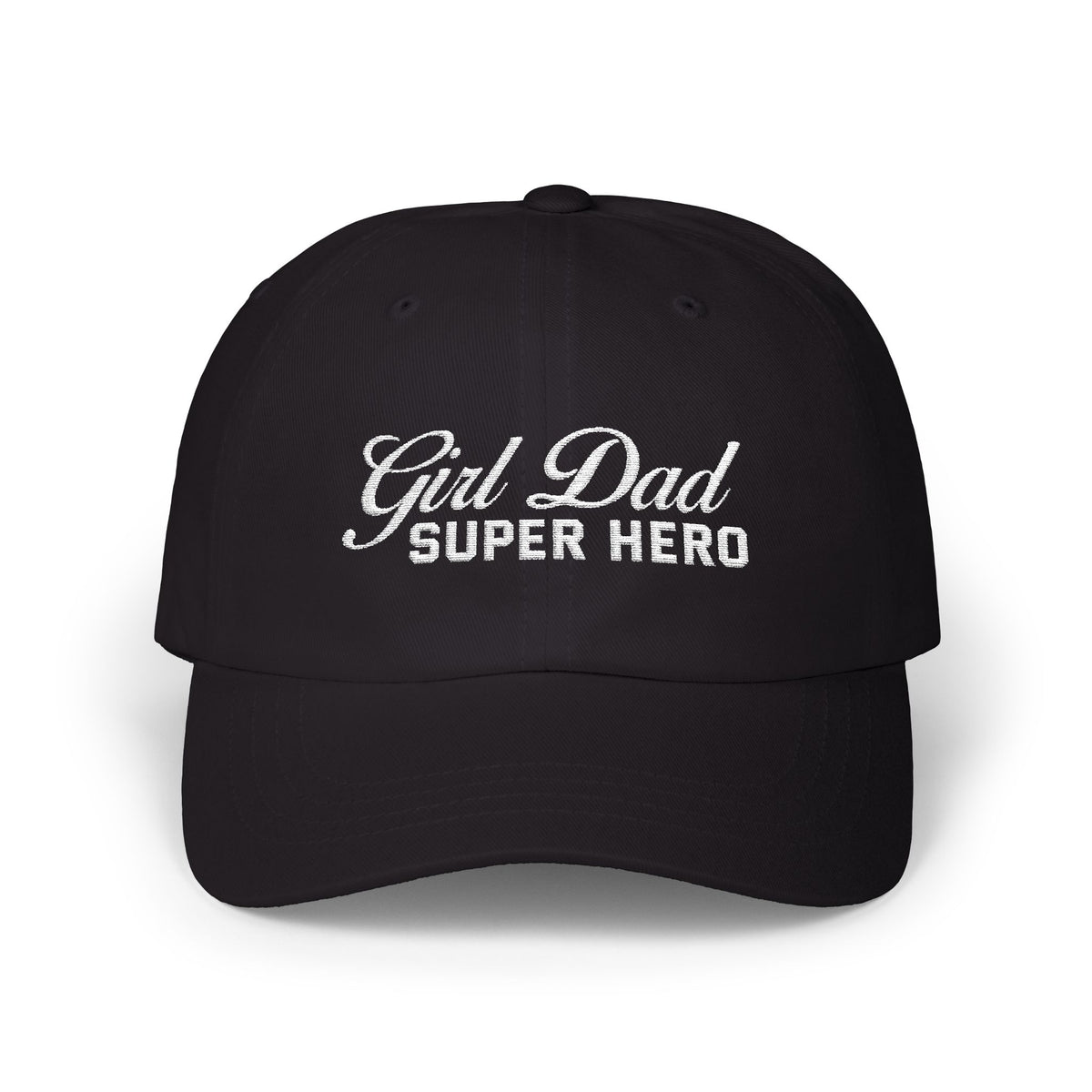 Woman wearing a black hat with mixed-script embroidered text reading “Girl Dad Super Hero” standing against a chain-link fence