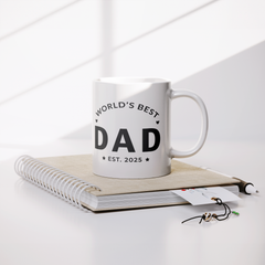 Worlds_Best_Dad_Est_2025_Mug_-_New_Dad_Lifestyle_Notebook_Mockup.png