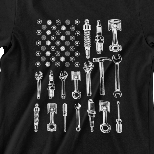 t-shirt featuring an American flag made of tools, gears, pistons, and wrenches – perfect gift for mechanics and tool lovers.
